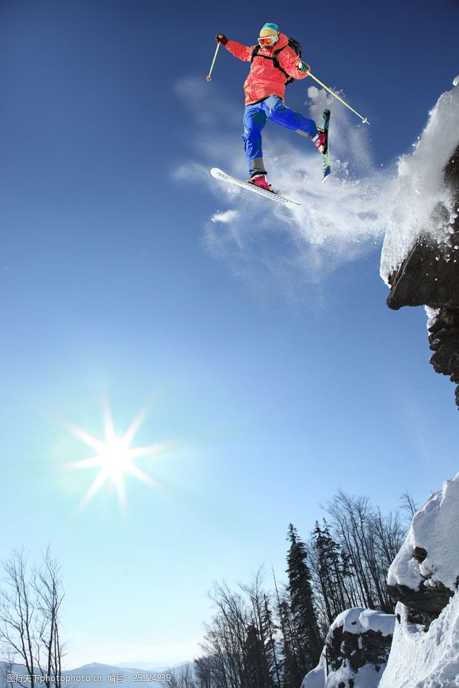极限运动从山崖飞下的滑雪运动员图片